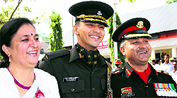 Gentleman cadet Bhanu Partap Mankotia, who has been awarded the sword of honour, along with his parents Col RPS Mankotia and Sunita after the passing-out parade at the Indian Military Academy in Dehradun on Saturday