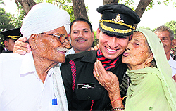 The proud grandparents of a gentleman cadet from the Jammu region congratulate him after the passing-out parade
