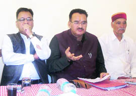 Ganesh Joshi, BJP legislator from Mussoorie, (second from left) addresses mediapersons in Mussoorie on Saturday. 