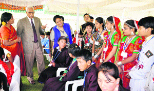 Governor NN Vohra and his wife Usha Vohra (right) interact with children at Raj Bhawan in Srinagar on Saturday.
