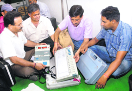 Election staff check poll material for MC polls before leaving for their respective polling booths in Jalandhar on Saturday. 