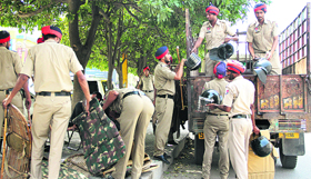 Police personnel on MC poll duty before leaving for their respective polling booths in Jalandhar on Saturday.