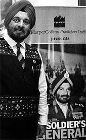 Former Army Chief and Governor of Arunachal Pradesh General JJ Singh poses with the cover of his autobiography in New Delhi on Saturday