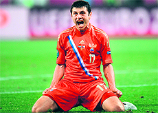 Russias Alan Dzagoev celebrates after scoring the third goal against Czech Republic at the Municipal stadium in Wroclaw on Friday. Russia won 4-1