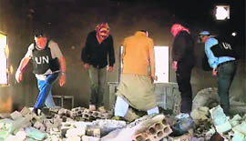Observers of the United Nations Supervision Mission in Syria inspect damages in the Syrian village of Al-Kubeir in the central province of Hama. 