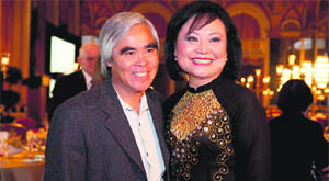 Photojournalist Nick Ut (left) and Kim Phuc Phan Thi pose at the 40th Anniversary Tribute Dinner in Honour of Kim Phuc Phan Thi in Toronto. 