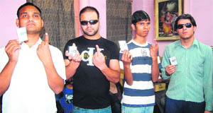 Visually challenged voters after exercising their franchise at a polling booth in Amritsar on Sunday.