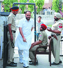 Congress candidate Iqbal Singh Dhillon Babli enters the Ambedkar Bhawan where counting was held on Sunday.