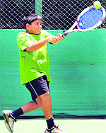 Manvir returns a shot during an under-12 qualifing match at CLTA in Chandigarh on Sunday