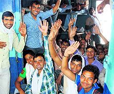After appearing in the examination conducted by the Railway Recruitment Board, candidates board a coach at the railway station of Chandigarh on Sunday