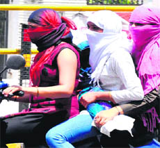 Girls violate traffic rules in Haridwar on Sunday. 