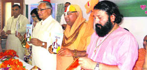 State Assembly Speaker Gobind Singh Kujnwal along with other dignataries during a book launch function at Chetan Jyoti Ashram in Haridwar on Sunday.
