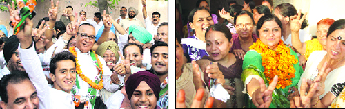 Congress candidates Jagdish Raj Raja and his wife Anita Raja celebrate after their victory from Wards 37 and 36, respectively, in Jalandhar on Sunday. 