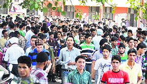 Aspirants come out after taking the entrance test for polytechnic courses in Government Womens College, Parade, in Jammu on Sunday