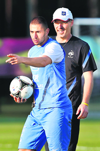 Frances Karim Benzema and teams coach Laurent Blanc during a training session in Kircha near Donetsk on Sunday.