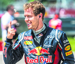 THE LEADER: Bull Racing Renault driver Sebastian Vettel of Germany gestures after finishing first in the qualifying session in Montreal.