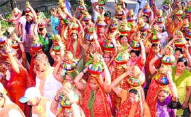 Devotees participate in a kalash yatra taken out before the idol installation ceremony at the Sanatan Dharam Temple in Sector 45, Chandigarh, on Monday