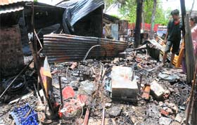 A view of some gutted shops at Maloya in Chandigarh on Monday