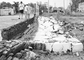 A boundary wall which fell at the government school in Dera Bassi