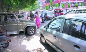 A view of a traffic jam near the passport office in Phase II Industrial Area, as it lacks parking space on the office premises, in Chandigarh