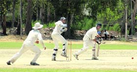 A batsman plays a shot during the match between Chandigarh and hosts Jalandhar on Monday