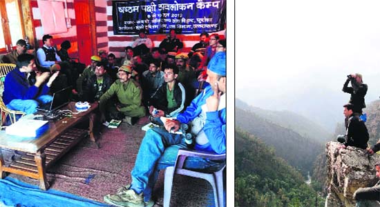 Forest Department personnel participate in a bird watching camp at the Govind National Park in Uttarkashi district; and (right) officials watch birds from a cliff