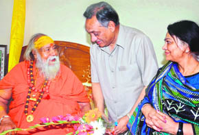 Chief Minister Vijay Bahuguna and his wife Sudha seek blessings of Shankaracharya Swaroopanand Saraswati in Haridwar on Monday.