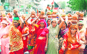 Women devotees take part in a kalash yatra during a procession in Gurgaon.
