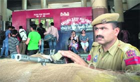 A jawan of the railway police stands guard at Jammu Railway Station on Monday