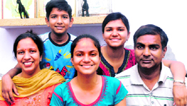 Radhika Gupta (centre), who got the third position in the state in Class X examinations of the Punjab School Education Board, with her parents and siblings in Jalandhar.