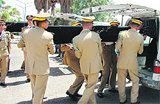 Government troops carry the coffins of two comrades killed in the ongoing fighting across Syria. 