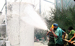 Firemen try to douse the flames at Khanna Paper Mill in Amritsar on Tuesday