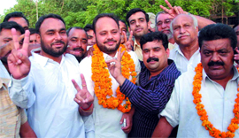 Iqbal Dhillon (second from left) of the Congress after winning the bypoll from ward 6 in Bathinda.