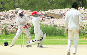A batsman plays a shot during the match between Chandigarh and hosts Jalandhar on Tuesday. 