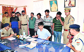 SSP Arun Mohan Joshi and SP (City) KL Shaw with the arrested criminals in Haridwar on Tuesday.