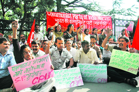 CPM activists hold a protest against the SP in Shimla 