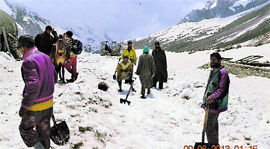 Workers clearing the Amarnath yatra track.