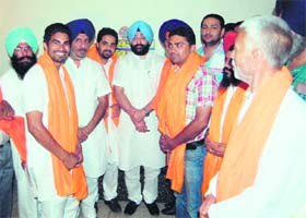 Another shot in the arm SAD MLA Inderbir Singh Bolaria welcomes Dinesh Kumar, an Independent candidate from Ward 3, and his supporters into the party in Amritsar