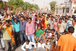 Garbage collectors protest outside the office of JITF Ecopolis and Ecopolis trucks line up on the Power House Road in Bathinda on Wednesday. 