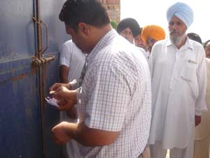 Officials sealing the waste treatment plant at Burj Mehma on Wednesday.
