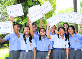 Students show their certificates after getting the first prize in a NASA project on “Space Colony on Mars”, in Chandigarh on Wednesday