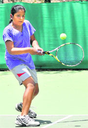 Prinkle Singh returns a shot during the U-16 CLTA-AITA Talent Series Tennis Tournament at the CLTA, Sector 10, Chandigarh, on Wednesday