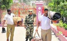 CRPF personnel arrive at a base camp in Jammu on Wednesday ahead of the Amarnath yatra. 