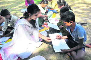 Malvika Upadhyay teaches children at Gole Market park in Jammu. 