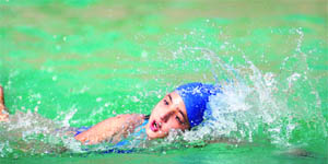 An aspirant takes part in the swimming trials in Ludhiana on Wednesday. 