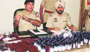 Swapan Sharma, ACP-North, and Surinder Mohan, SHO, with the seized drugs in Ludhiana on Wednesday. 
