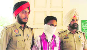 The accused in police custody.