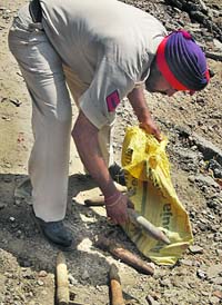 A Punjab police cop collects connecting pins in Jalandhar.