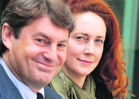 Former News International chief executive Rebekah Brooks and her husband Charlie Brooks leave a court in London on Wednesday