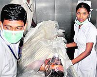 An injured is treated at a hospital after an explosion at the steel plant in Vizag on Thursday